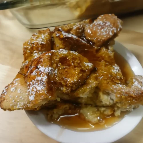 pumpkin french toast casserole drizzled with syrup