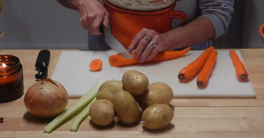 prepping carrots, onions and potatoes