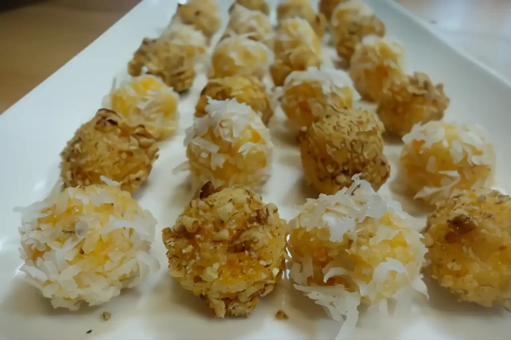 apricot-coconut-balls-on-white-platter-close-up