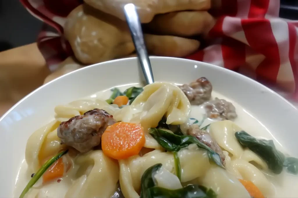 creamy-tortellini-soup-in-serving-dish-side-view