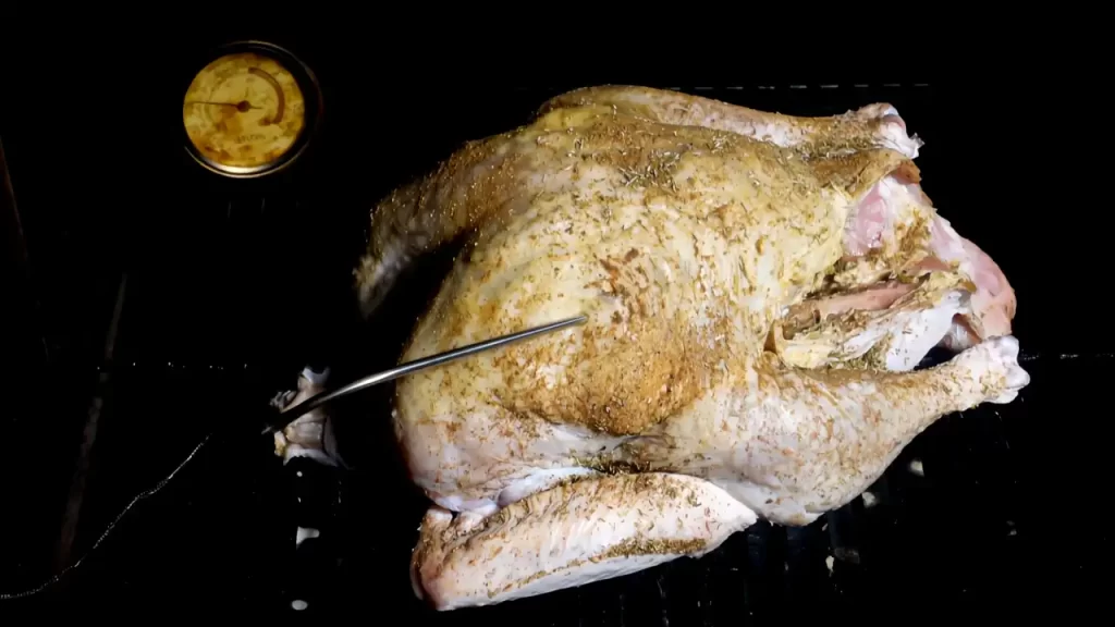 turkey-placed-on-grill-with-thermometer