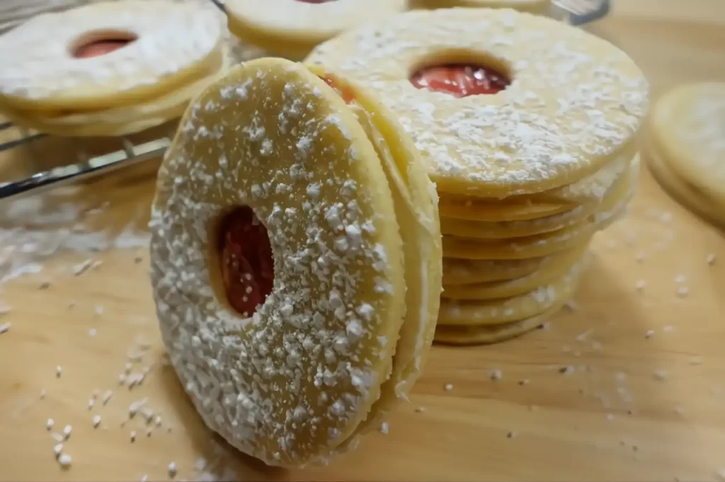 raspberry-cream-sandwich-cookies dusted with powdered sugar