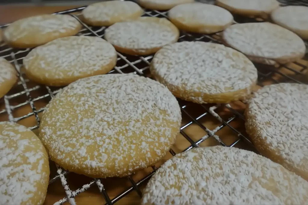 shortbread-cookies-on-cooling-rack-dusted-with-powdered-sugar.