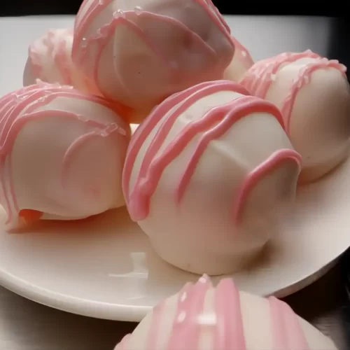 strawberry-cream-cheese-truffles-on-white-plate