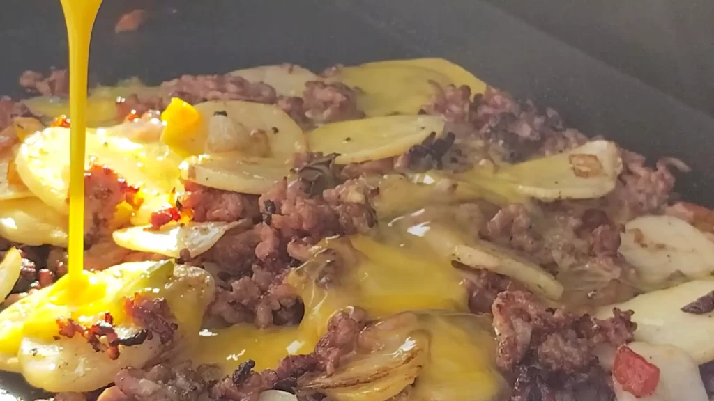 adding-eggs-to-breakfast-griddle