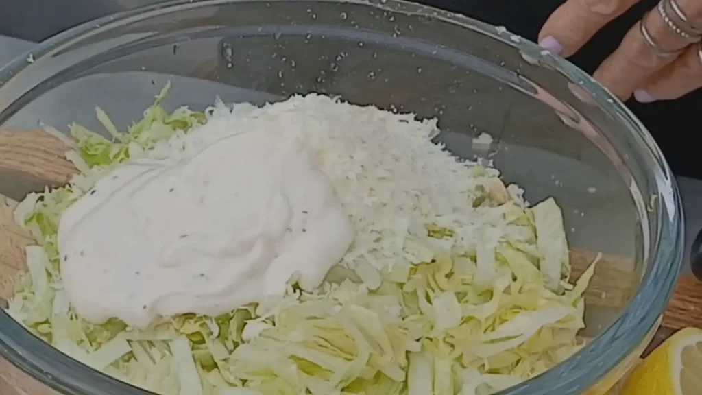 mixing-caesar-salad-for-grilled-chicken-caesar-salad