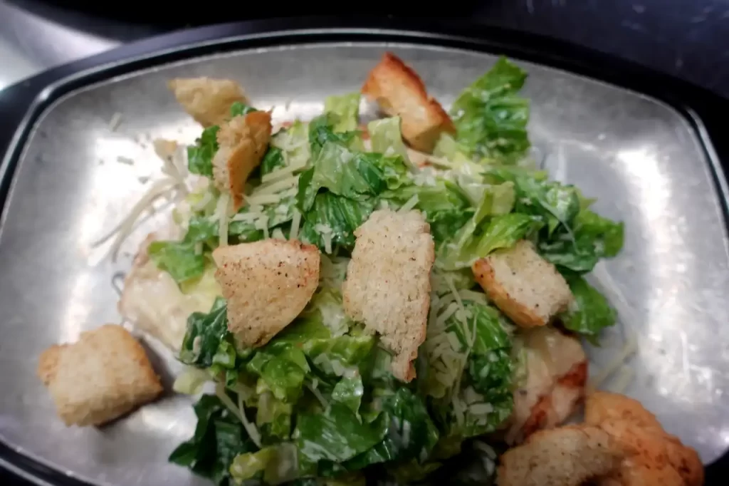 top view grilled chicken caesar salad