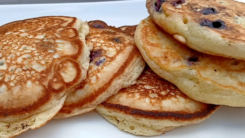 blueberry-pancakes-on-white-platter.