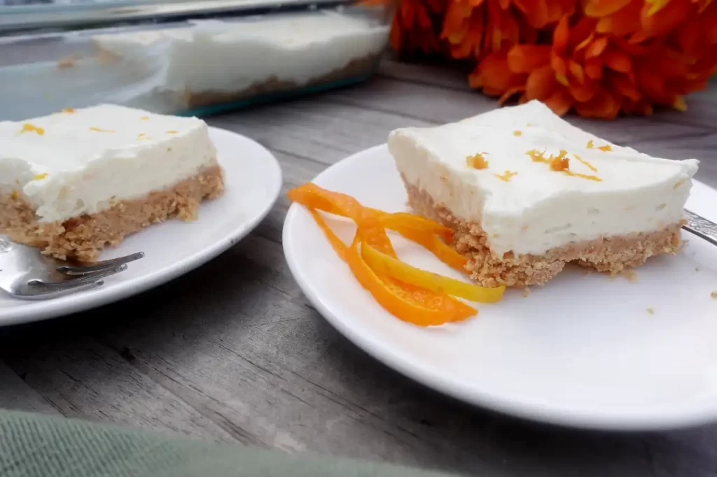 citrus-cheesecake-bars-on-serving-plates
