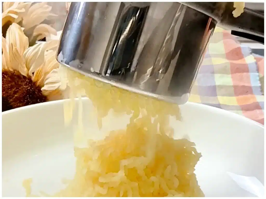 close-up-potatoes-being-riced