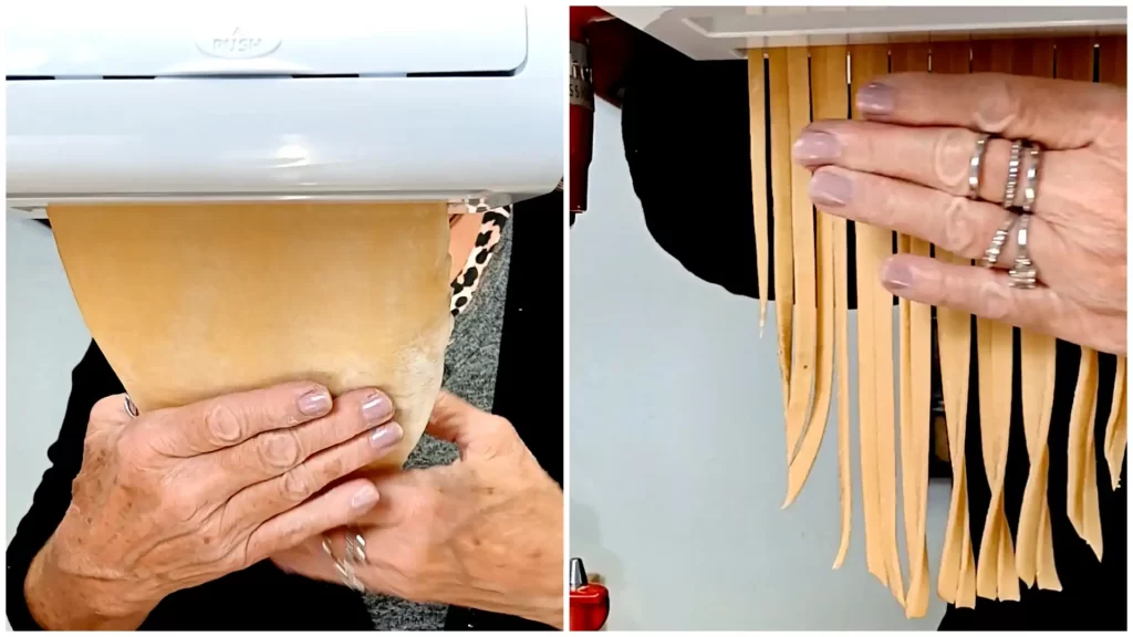 homemade-noodle-being-run-through-kitchen-aid-pasta-attatchment