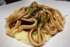homemade-noodles-with-beef-over-mashed-potatoes