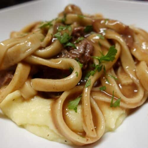 homemade-noodles-with-beef-over-mashed-potatoes