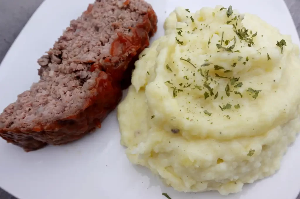 top-view-creamy-mashed-potatoes-with-a-side-of-meatloaf