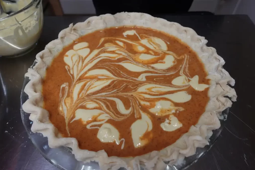 unbaked-pumpkin-pie-with-cream-cheese-swirl.