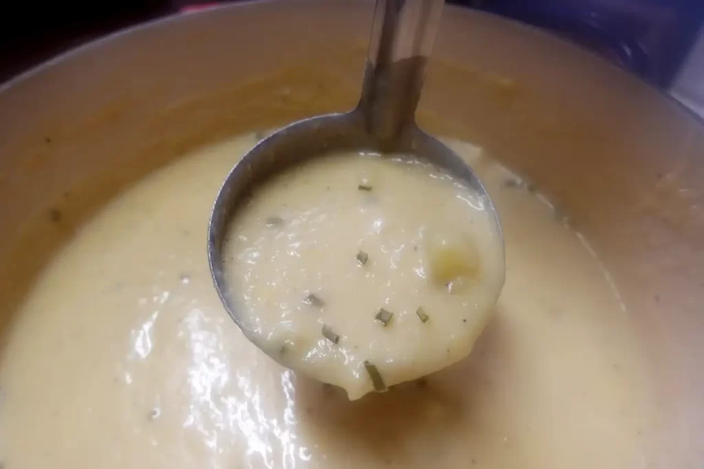 close-up-of-laddle-full-of-potato-leek-soup.
