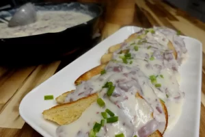 platter-of-cream-dried-beef-over-toast-with-skillet-in-background.
