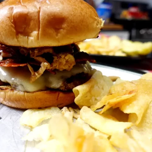 cowboy smashed burger with a side of potato chips