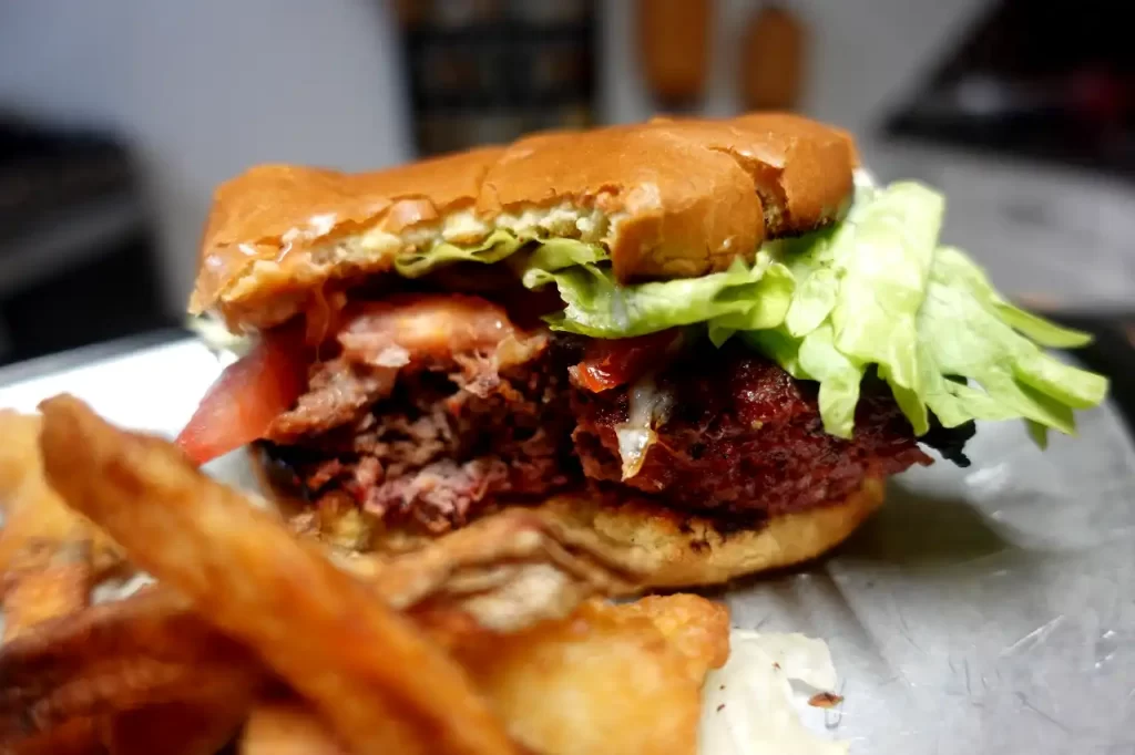 close-up-of-smoked-cheese-burger-with-bite-taken-out