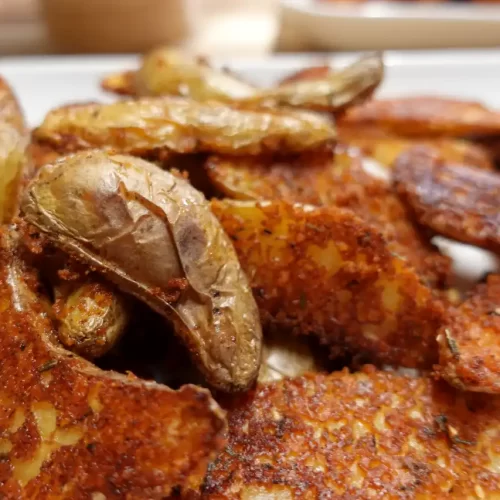 crispy-parmesan-fingerling-potatoes-on-white-platter.