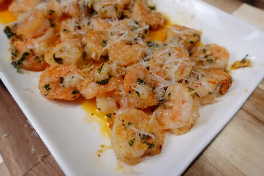 garlic-parmesan-shrimp-bake-on-white-serving-tray.