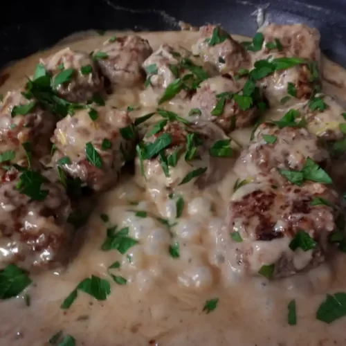 top-view-meatballs-in-creamy-leek-sauce-in-skillet