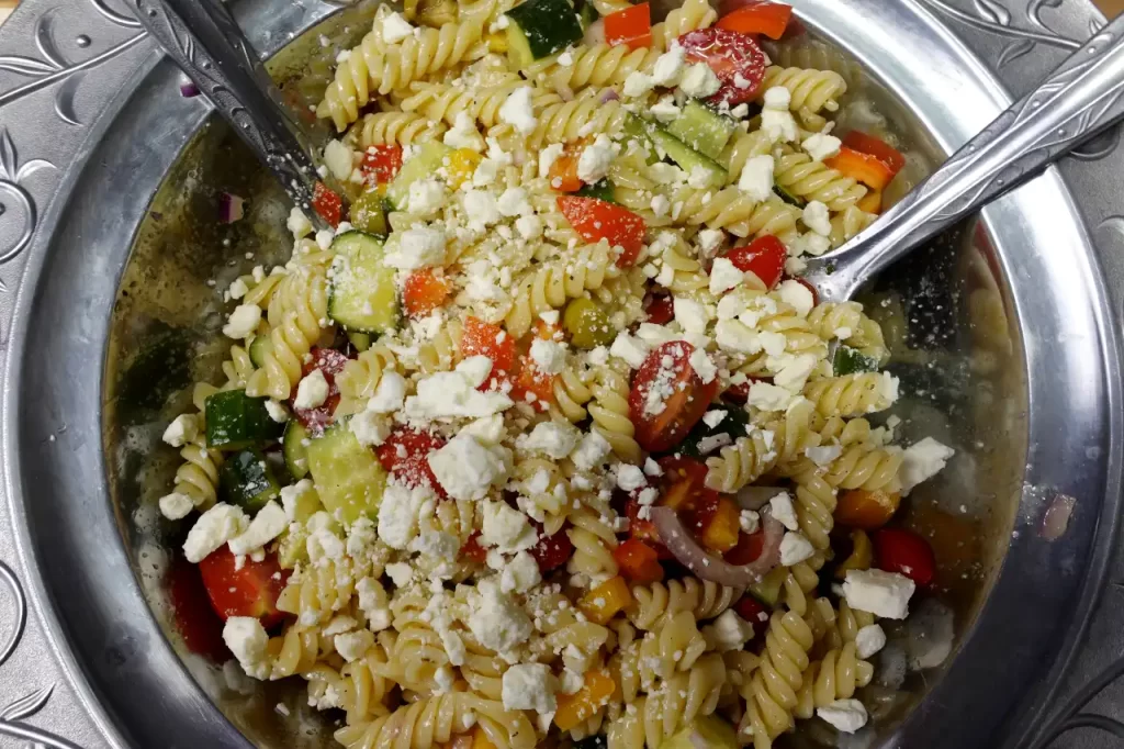 top-view-mediterranean-pasta-salad-in-salad-bowl.