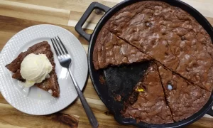 close-up-of-cadbury-egg-brownie-skillet-with-scoop-of-ice-cream-on-top.