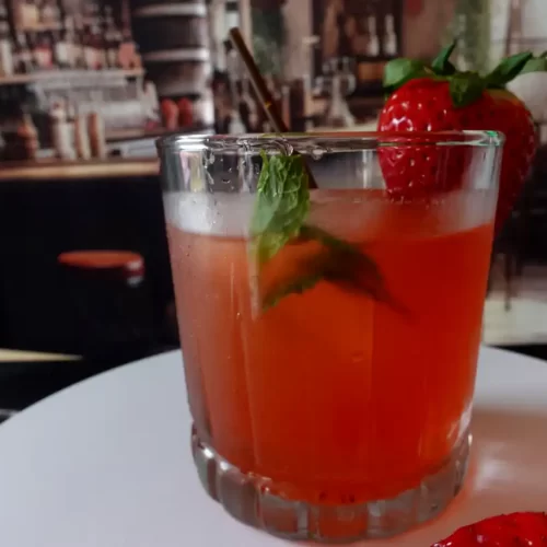 close-up-strawberry-rum-splash-on-bar.webp