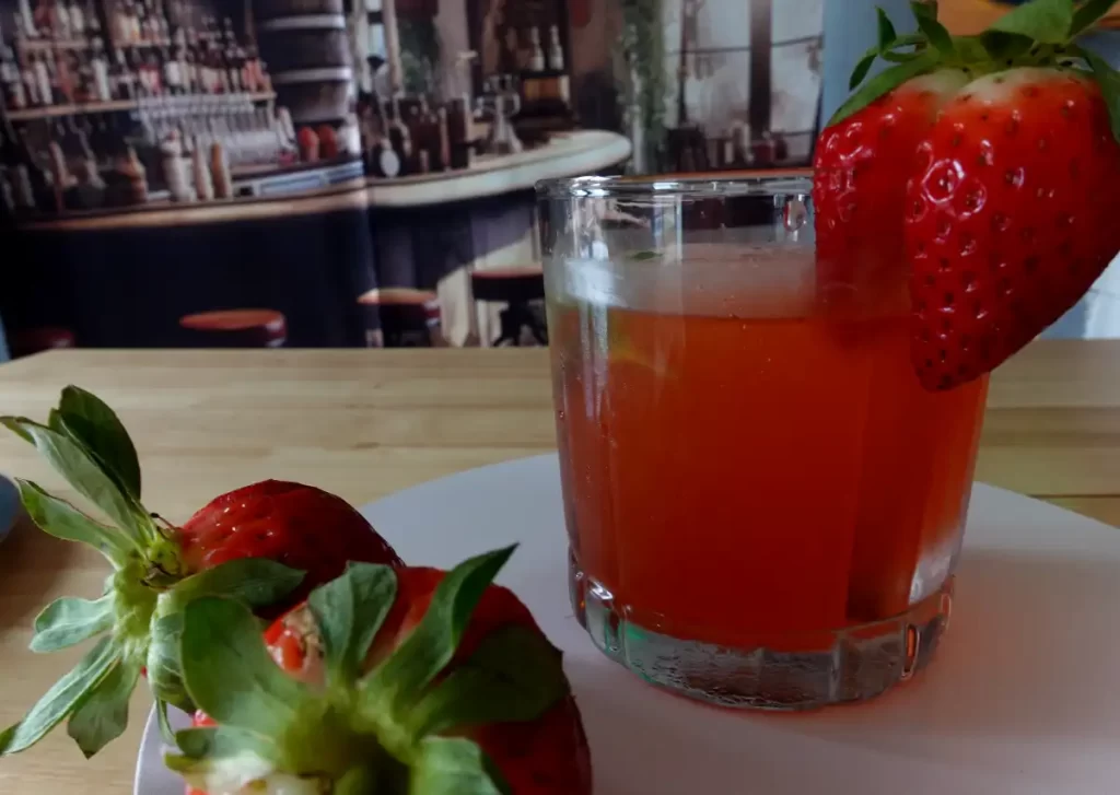 strawberry-rum-smash-with-old-bar-scene-in-background