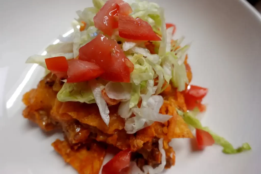 taco-casserole-with-lettuce-and-tomato-topping.