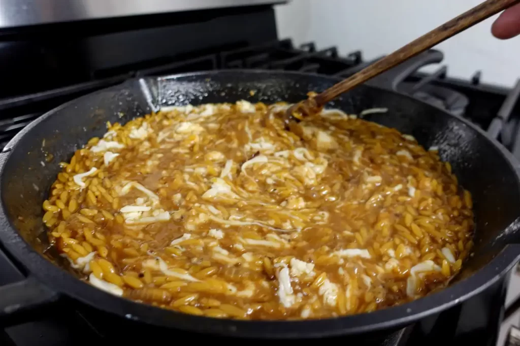 adding-cheese-and-orzo-to-carmelized-onions