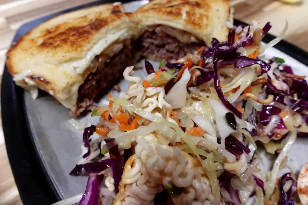 ramen-crunch-salad-on-platter-with-burger