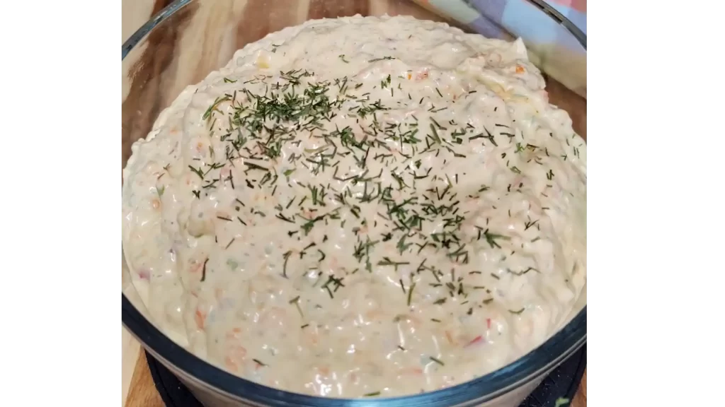 close-up-of-bowl-of-veggie-cream-cheese-spread-with-dill.