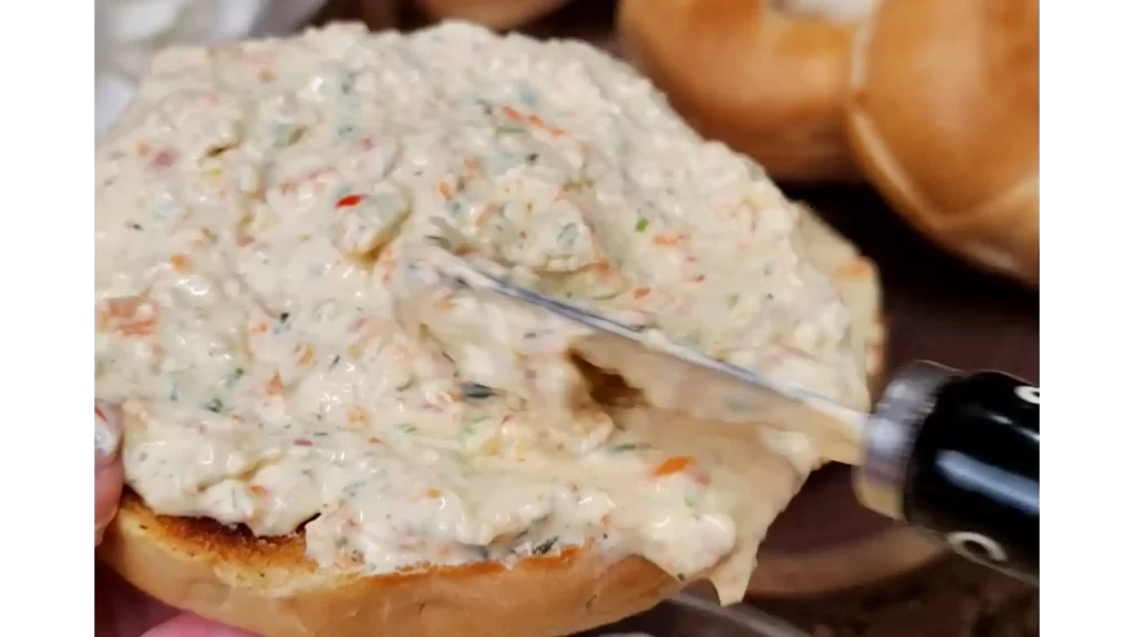 close-up-veggie-cream-cheese-spread-on-bagel.