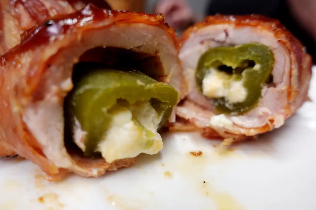 jalapeno-popper-chicken-bombs-cut-in-half-with-cheese-oozing