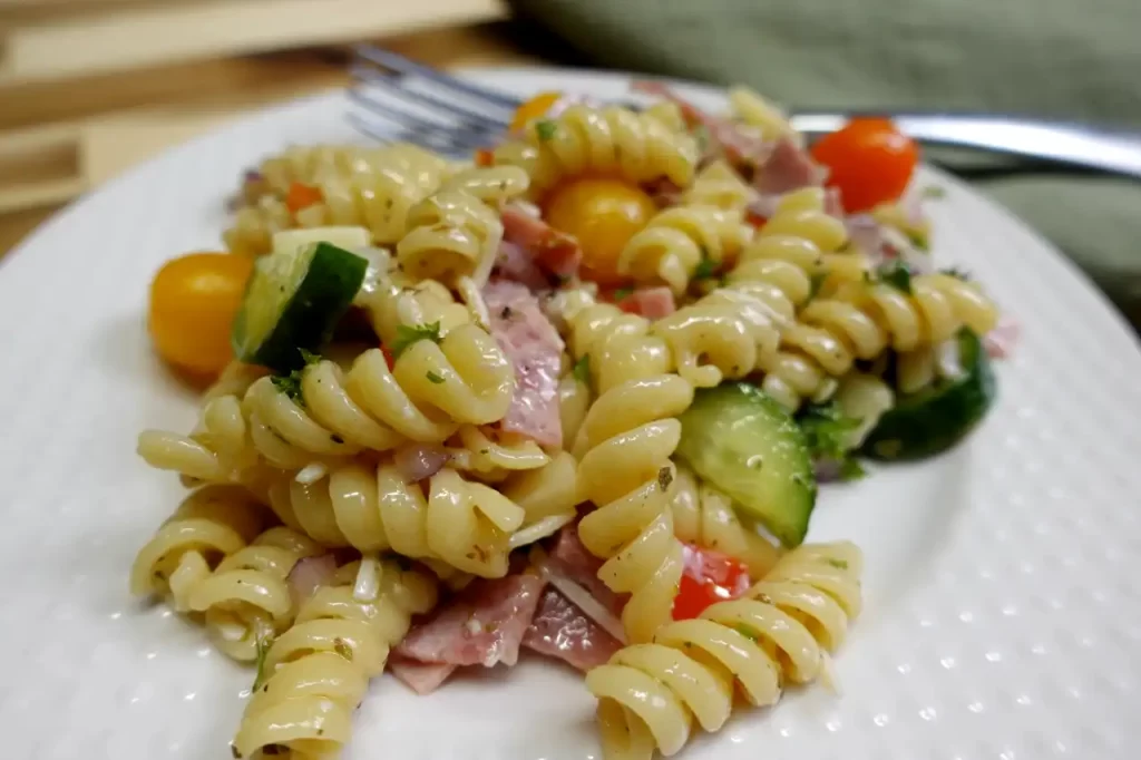 loaded-italian-pasta-salad-on-white-serving-plate