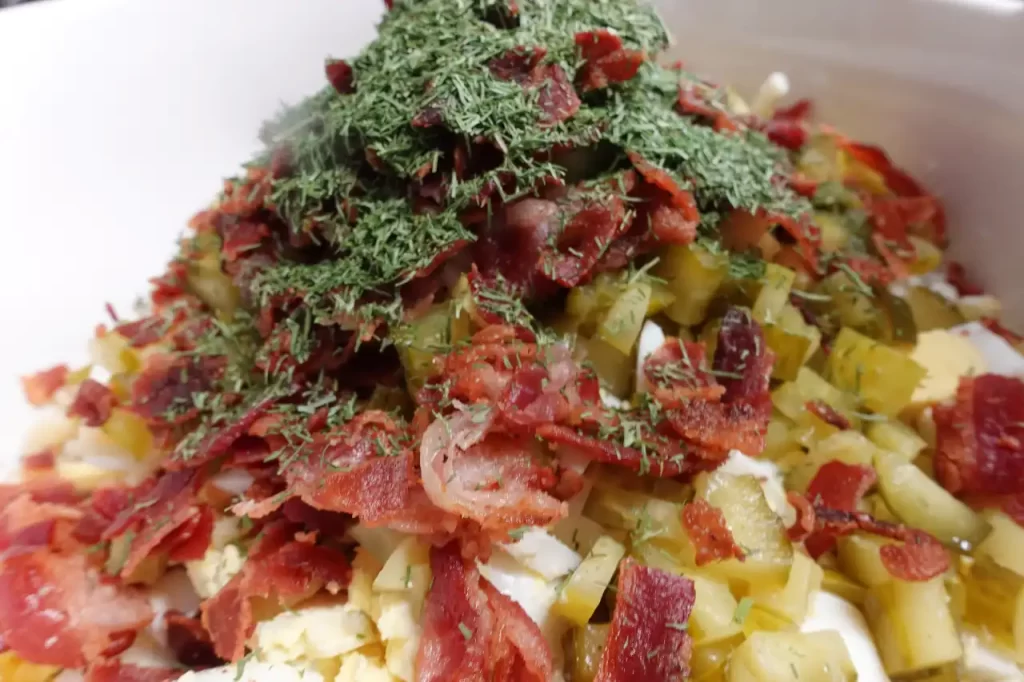 big dill pasta salad ingredients in bowl