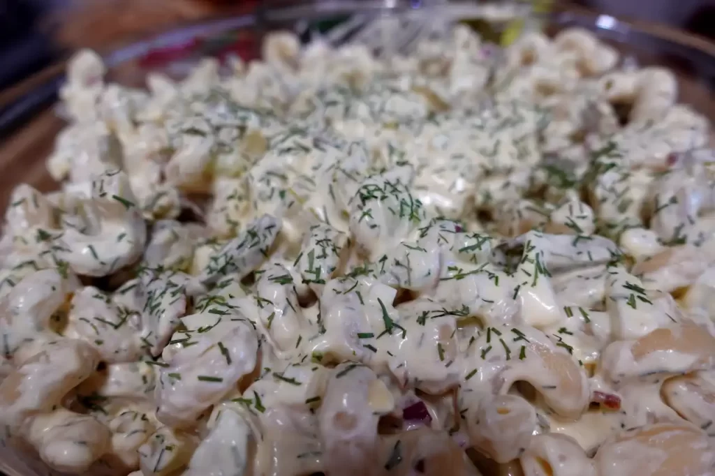 big-dill-pasta-salad-in-serving-bowl-with-fresh-dill