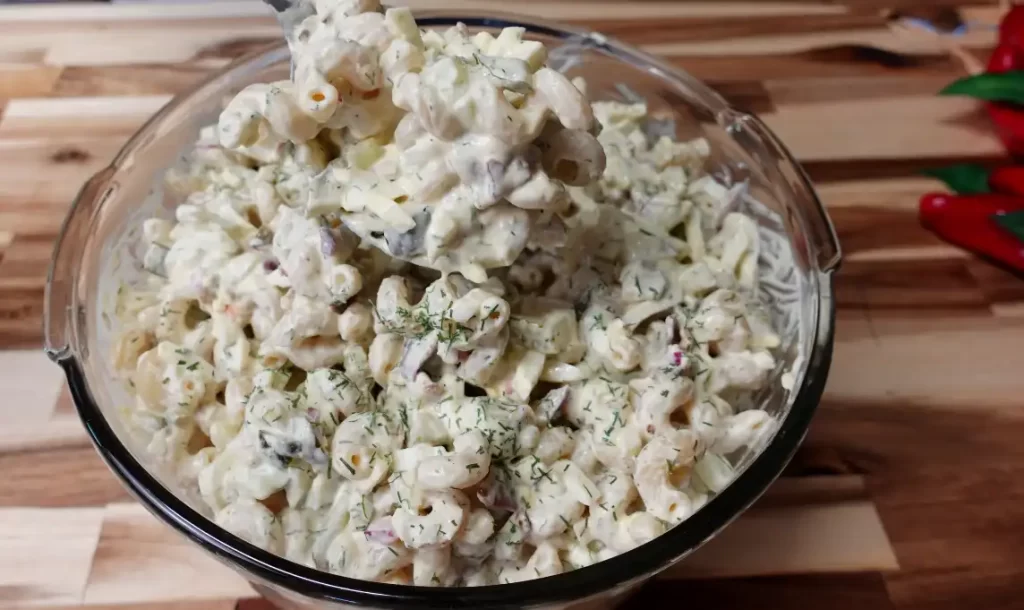 big-dill-pasta-salad-top-view-with-spoon-on-wooden-table