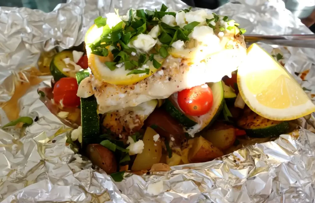 close-up-haddock-on-foil-with-feta-sprinkled-on-top