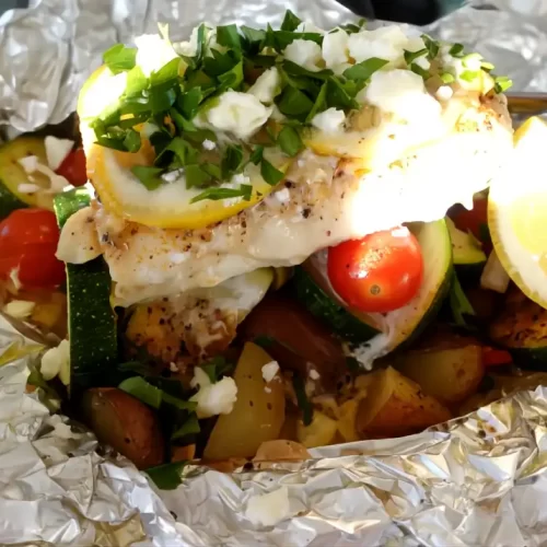 close-up-haddock-on-foil-with-feta-sprinkled-on-top