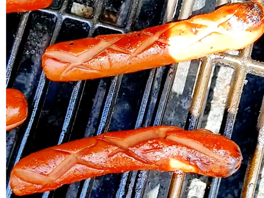 scored-hot-dogs-on-the-grill.