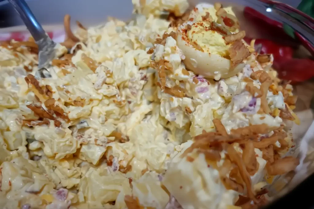 serving-a-spoonful-of-devviled-egg-potato-salad.