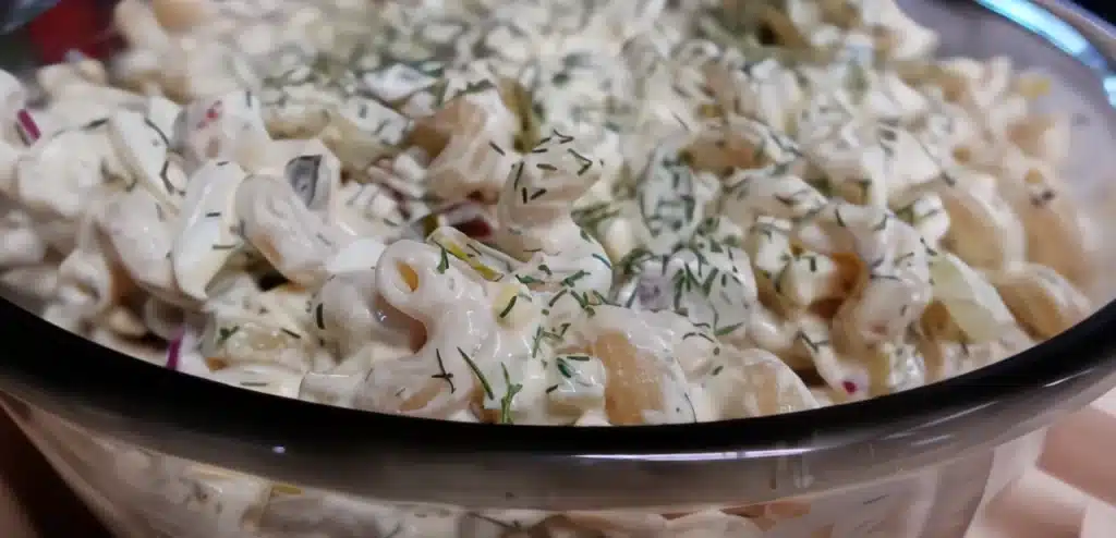 side-view-close-up-big-dill-pasta-salad-with-fresh-dill.