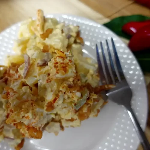 top-view-of-deviled-egg-potato-salad-on-a-serving-plate