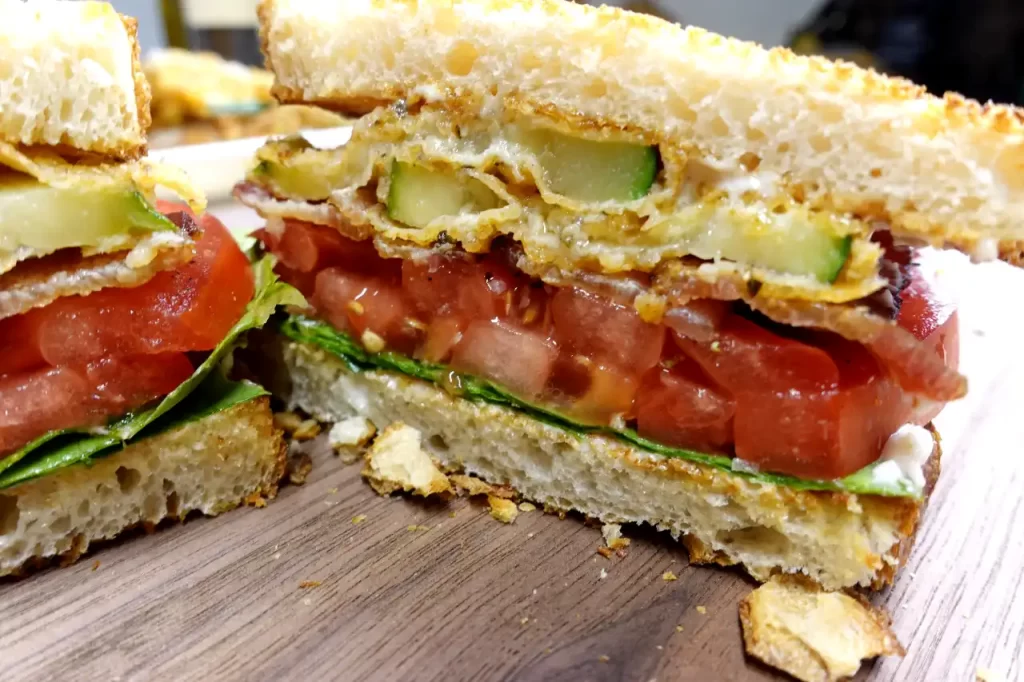 Crispy-Fried-Zucchini-BLT-made-with-Parmesan-crusted-zucchini-bacon-tomatoes-lettuce-mayonnaise-and-toasted-sourdough-bread.webp