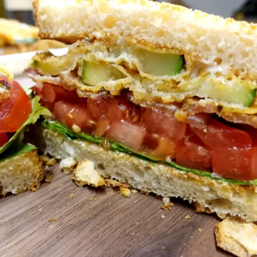 Crispy-Fried-Zucchini-BLT-made-with-Parmesan-crusted-zucchini-bacon-tomatoes-lettuce-mayonnaise-and-toasted-sourdough-bread.webp