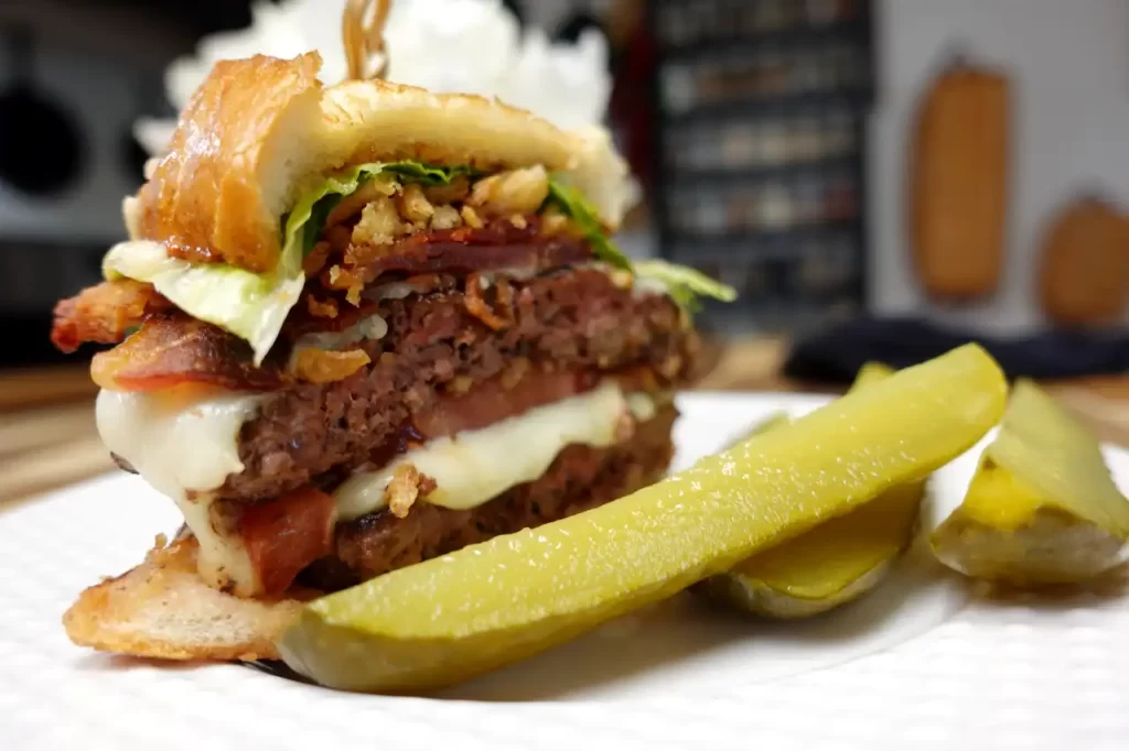 texas-toast-smash-burger-with-pickles-on-the-side.webp