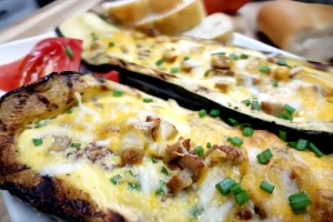 Grilled-breakfast-stuffed-zucchini-boats-filled-with-sausage-eggs-and-melted-cheddar-cheese